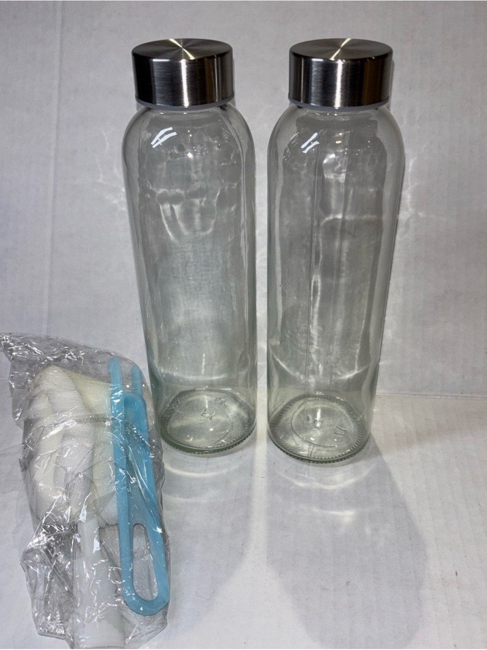 Clear Glass Water Bottle Set with Silver Stainless Caps - 2 Pack
